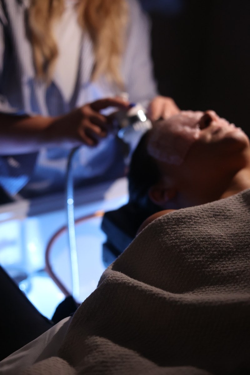 The head spa room under blue light at LŪK House of Beauty